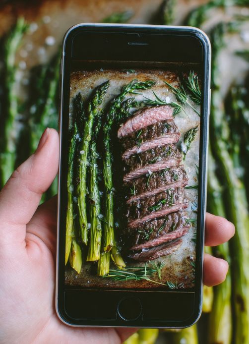 Nutrition coaching client following the primal paleo diet logging a steak and asparagus meal using Coach Donovan’s tracking app.